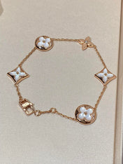 STAR AND SUN 5 MOTIF MOP PINK GOLD BRACELET