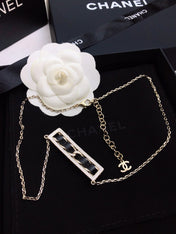 CHANEL 26S CHANEL CC LOGO CRYSTAL TRIM BAR PENDANT NECKLACE WITH BLACK LEATHER IN GOLD METAL 633315