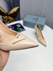 PRADA 26S POINTED TOE PUMPS STILETTO HEEL 95MM IN NUDE BEIGE PATENT CALFSKIN LOGO