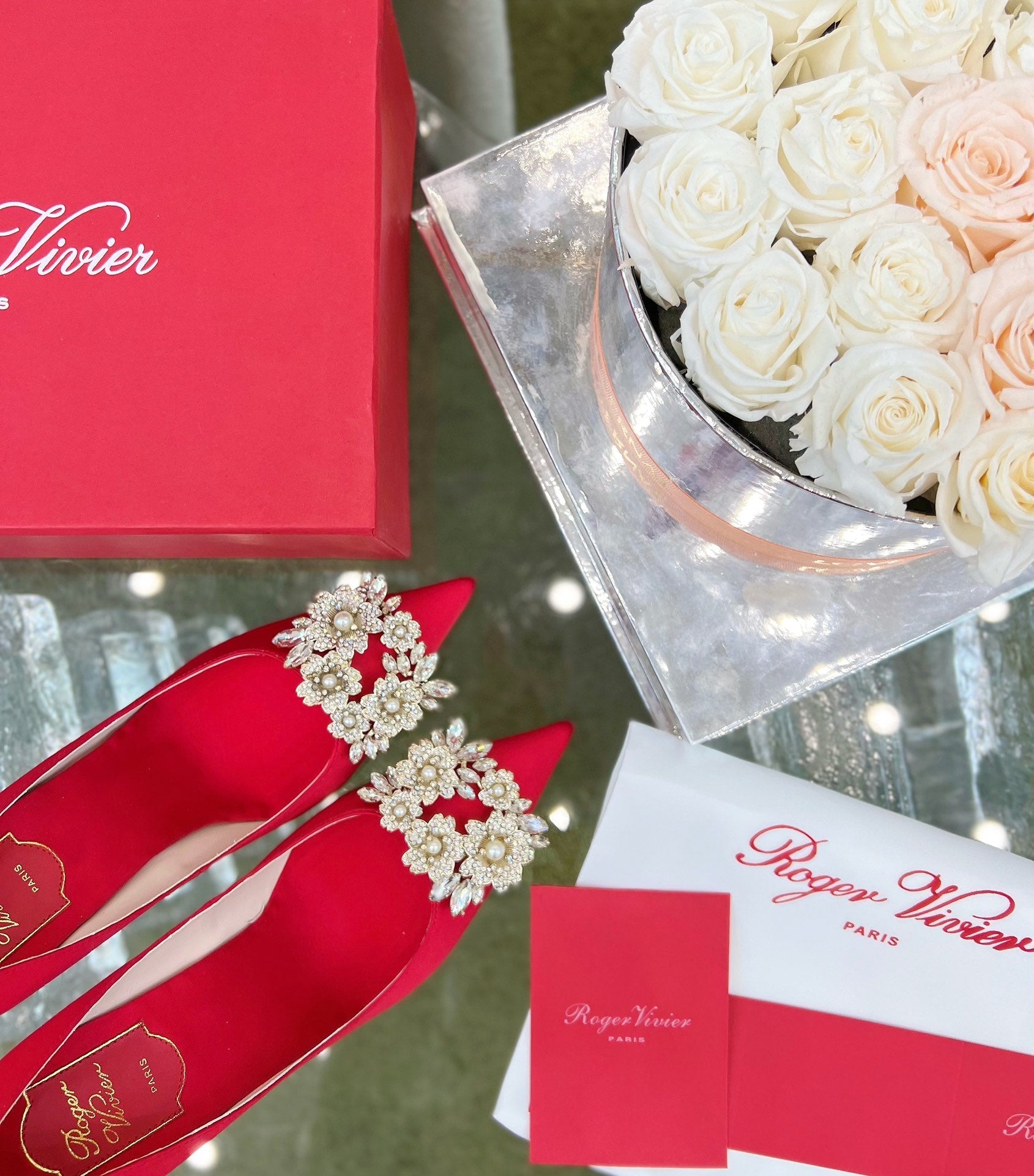 EFFLORESCENCE POINTED-TOE PUMPS IN RED SATIN WITH CRYSTAL BUCKLE