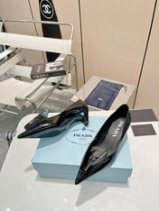 KITTEN HEEL PUMPS WITH CREATIVE SHAPE IN BLACK GLOSSY LAMBSKIN