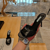PRADA 26S OPEN TOE MULES 100MM IN BLACK PATENT CALFSKIN WITH LOGO