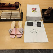 PRADA 26S OPEN TOE MULES 45MM IN BLUSH PINK PATENT CALFSKIN WITH ROSETTE