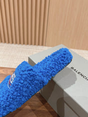 FURRY SLIDES IN COBALT BLUE CURLY SHEARLING