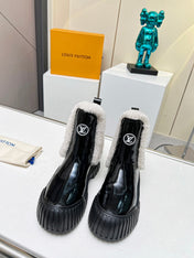 LV RUBY FLAT ANKLE BOOT IN BLACK CALFSKIN AND WHITE SHEARLING