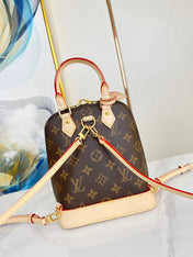 ALMA BACKPACK 20 IN BROWN MONOGRAM CANVAS AND BEIGE CALFSKIN TRIM GOLD BUCKLE