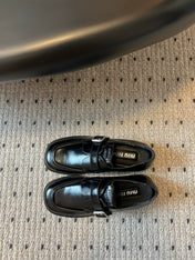 MIUMIU 26S SLIP-ON LOAFERS IN BLACK CALFSKIN SQUARE BUCKLE