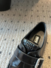 MIUMIU 26S SLIP-ON LOAFERS IN BLACK CALFSKIN SQUARE BUCKLE