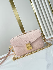 POCHETTE MÉTIS EAST WEST 21 IN PINK OPALE MONOGRAM ECLIPSE CANVAS GOLD BUCKLE
