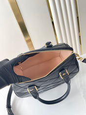 SPEEDY BANDOULIÈRE 25 WITH CRISS CROSS PATTERN IN BLACK LAMBSKIN
