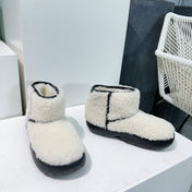 MINI ANKLE BOOT IN WHITE SHEARLING WITH BLACK ULTRA LIGHTWEIGHT RUBBER OUTSOLE