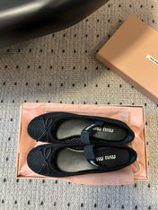MIUMIU 26S BALLERINAS IN BLACK MESH FABRIC WITH BOW