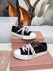 WASHED-DENIM SNEAKERS IN BLACK CANVAS WITH BROWN AND STRIPED LACES