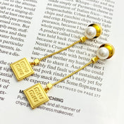 MIUMIU 26S PEARL BAR DROP LOGO EARRINGS IN GOLD TONE METAL 629846