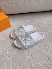 LV EMBOSSED POOL PILLOW SANDALS IN WHITE RUBBER