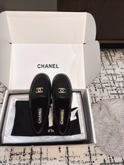 SLINGBACK LOAFER IN BLACK CALFSKIN AND SHEARLING