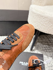 PRADA 25S DEXUN MULE IN BURNT ORANGE SUEDE LEATHER