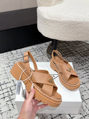 PRADA 25S CRISSCROSS SANDALS IN BURNT ORANGE CALFSKIN LOGO