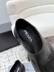 PRADA 26S SLIP ON SHOES IN BLACK SMOOTH CALFSKIN