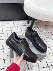 PRADA 26S SNEAKERS IN BLACK SHINY CALFSKIN