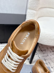 PRADA 26S SNEAKERS IN GOLDEN BROWN SHINY CALFSKIN