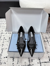 PRADA 26S POINTED-TOE HIGH HEELS 55MM IN BLACK PATENT CALFSKIN WITH BOW