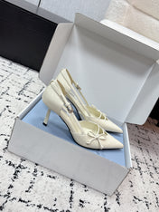 PRADA 26S POINTED-TOE HIGH HEELS 75MM IN IVORY WHITE PATENT CALFSKIN WITH BOW