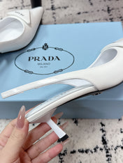 PRADA 26S SLINGBACK PUMPS 60MM IN WHITE PATENT CALFSKIN