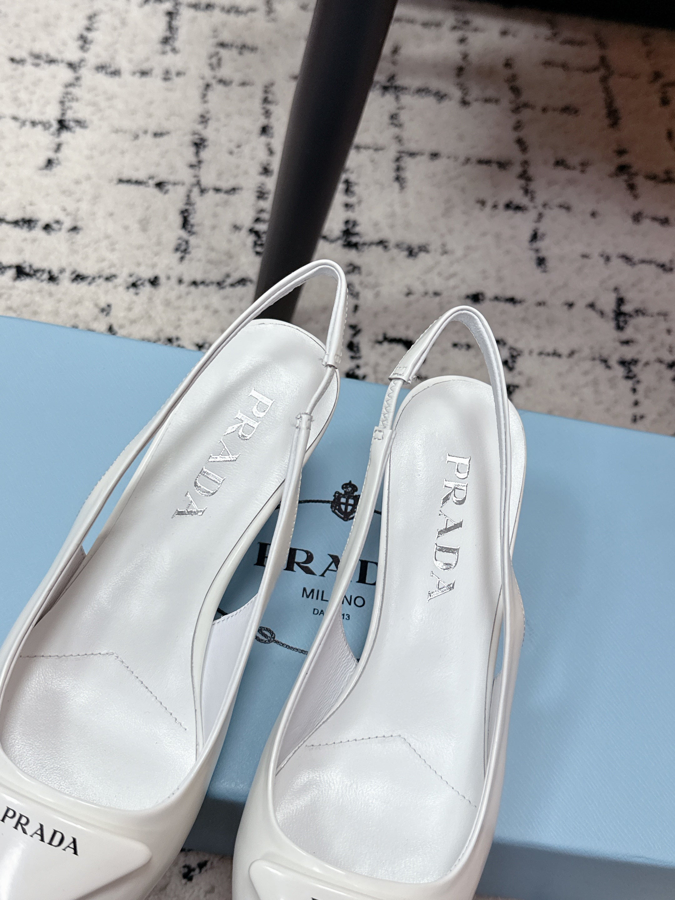PRADA 26S SLINGBACK PUMPS 60MM IN WHITE PATENT CALFSKIN