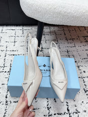 PRADA 26S SLINGBACK PUMPS 60MM IN CREAM WHITE PATENT CALFSKIN