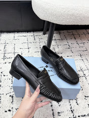 PRADA 26S LOAFERS 25MM IN BLACK CALFSKIN