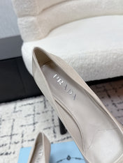 PRADA 26S POINTED-TOE HIGH HEELS 60MM IN CREAM WHITE PATENT CALFSKIN WITH LOGO