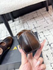 ALAIA 26S CROSS-STRAP BALLET FLATS IN DARK BROWN LAMBSKIN