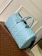 KEEPALL BANDOULIÈRE 50 IN SKY BLUE MONOGRAM SHADOW EMBOSSED CALFSKIN