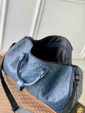 KEEPALL BANDOULIÈRE 50 IN DARK BLUE MONOGRAM SHADOW EMBOSSED CALFSKIN