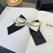 CHANEL 26S BOW HAIR CLIP IN BLACK AND WHITE SATIN 503132