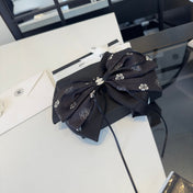 CHANEL 26S BOW HAIR CLIP IN BLACK SATIN 503133