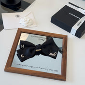 CHANEL 26S BOW HAIR CLIP IN BLACK SATIN 503134