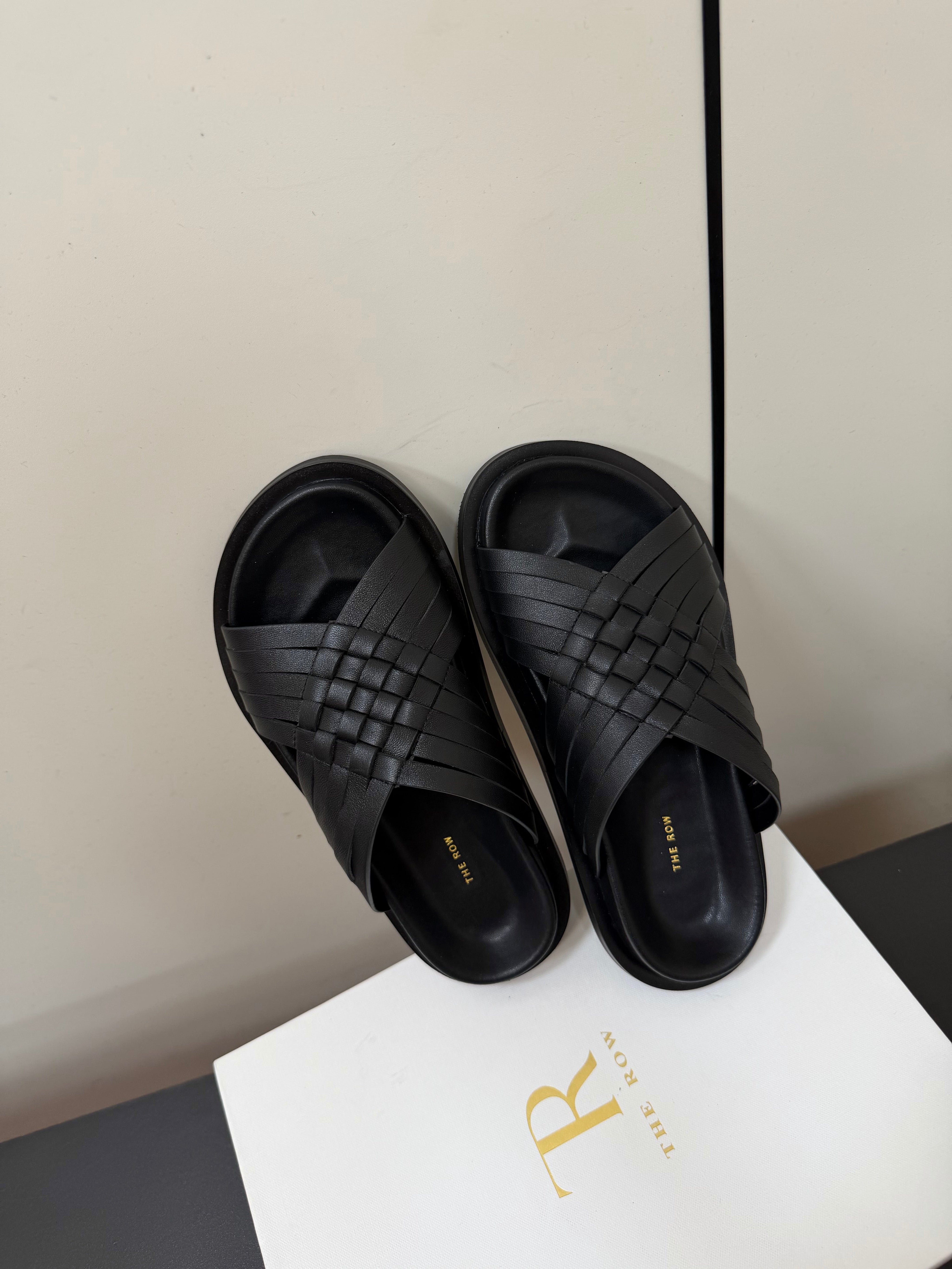 THE ROW 26S CROSS STRAP SANDALS IN BLACK CALFSKIN