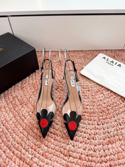 ALAIA 26S POINTED-TOE SLINGBACK HEELS IN BLACK LAMBSKIN AND TRANSPARENT PVC