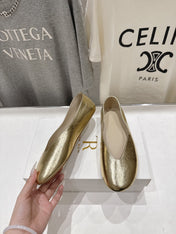 THE ROW 26S BALLET FLATS IN GOLD CALFSKIN
