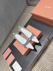 MIUMIU 26S POINTED TOE PUMPS 55MM IN WHITE AND BLACK CALFSKIN WITH BOW