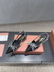 MIUMIU 26S SLINGBACK 55MM IN BLACK AND WHITE CALFSKIN WITH BOW
