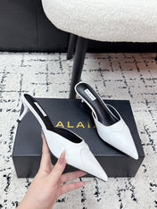 ALAIA 26S HEELED MULES 65 MM IN WHITE GLOSSY CALFSKIN