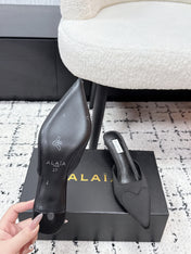 ALAIA 26S HEELED MULES 65 MM IN BLACK SATIN
