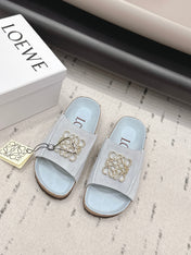LOEWE 26S FLAT SANDALS IN LIGHT BLUE LOGO GOLD HARDWARE