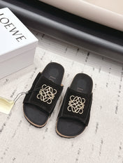 LOEWE 26S FLAT SANDALS IN BLACK LOGO GOLD HARDWARE