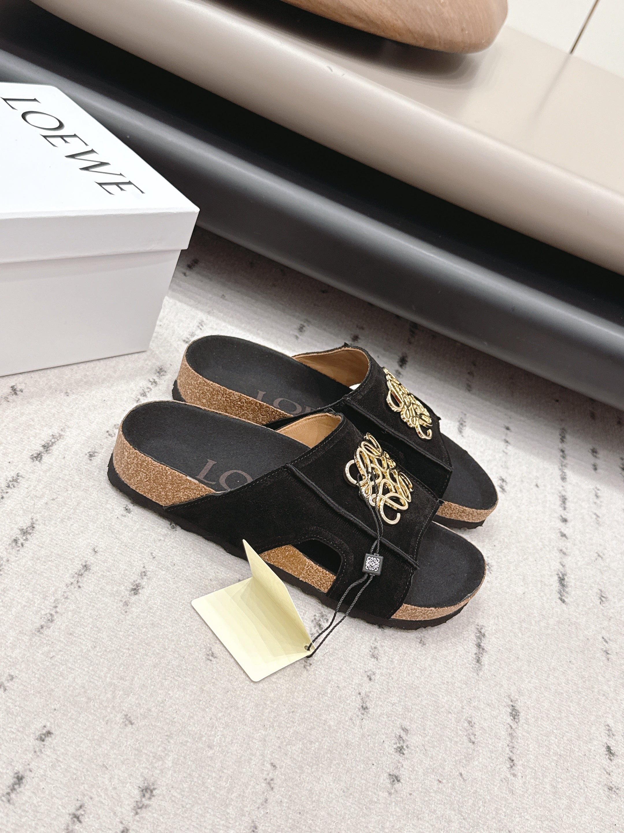 LOEWE 26S FLAT SANDALS IN BLACK LOGO GOLD HARDWARE