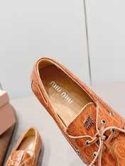MIUMIU 26S BOAT SHOES IN ORANGE BROWN EMBOSSED CALFSKIN