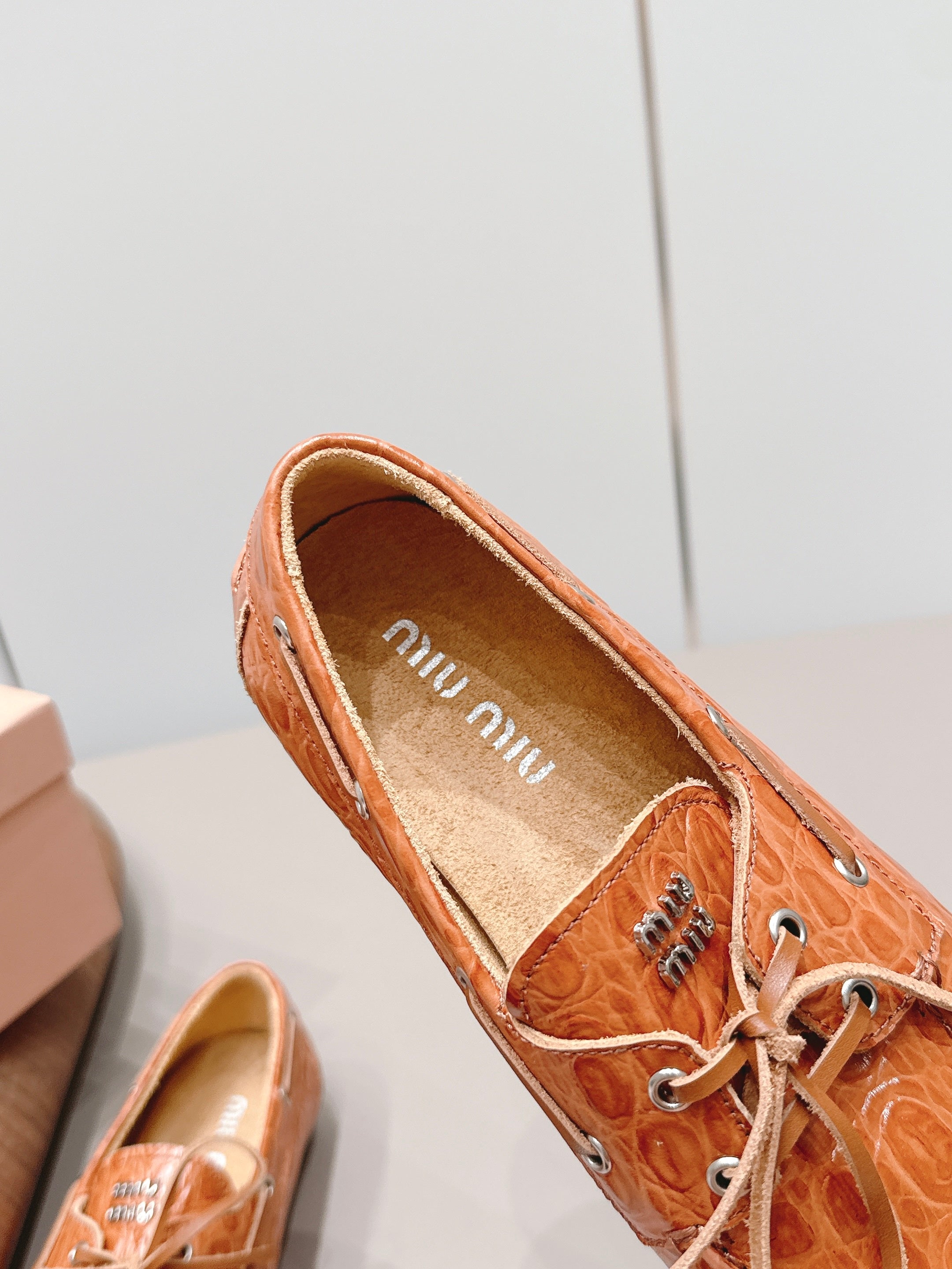 MIUMIU 26S BOAT SHOES IN ORANGE BROWN EMBOSSED CALFSKIN